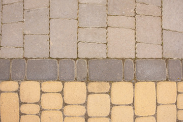 Fototapeta premium Beautiful brown texture made of paving stones in a row.
