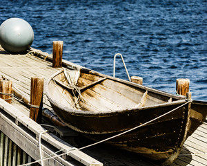 Old boat on pier, norway fjord