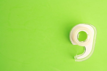 office adhesive tape on colored background