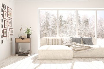 Stylish room in white color with sofa and winter landscape in window. Scandinavian interior design. 3D illustration