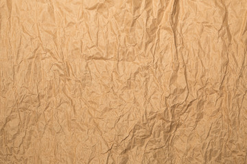 Shabby light brown kraft paper background in evening sunlights