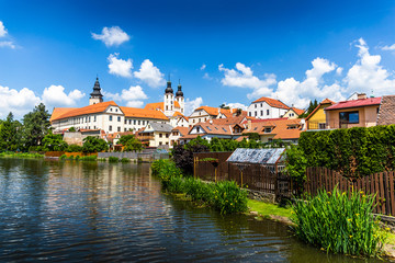 View of Telc across pond with reflections, Unesco world heritage site, South Moravia, Czech Republic.