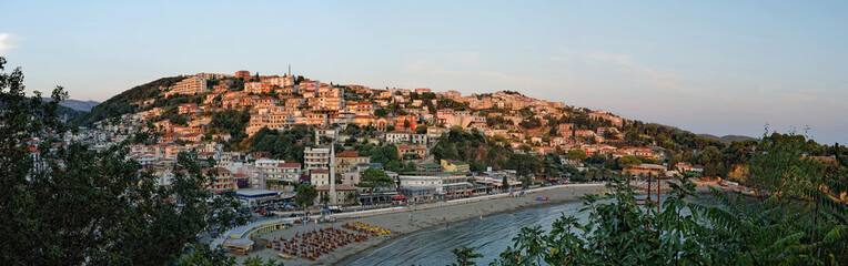 Fototapeta na wymiar Panoramic view on Ulcinj old town fortress with purple after sunset light. Adriatic sea at sunset in Montenegro.