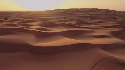 Beautiful landscape of the Namib Desert under the wing of the aircraft at sunset. Flying on a plane over the desert is one of the most popular tourist attractions