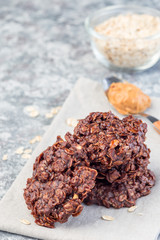 Flourless no bake peanut butter and oatmeal chocolate cookies, vertical, copy space