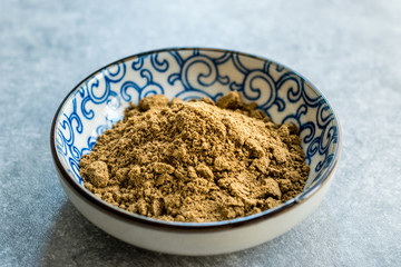 Indian Garam Masala Powder in Small Traditional Porcelain Bowl.