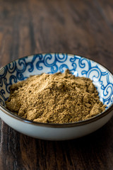 Indian Garam Masala Powder in Small Traditional Porcelain Bowl.