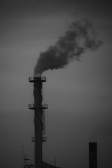 black $ white The factory released smoke chimney in sunset. Global warming concept