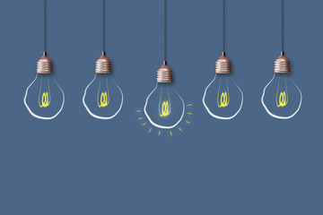 Concept Idea. Light bulb on a blue background. The concept of bright ideas for business, frequently...
