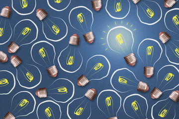 Concept Idea. Light bulb on a blue background. The concept of bright ideas for business, frequently...