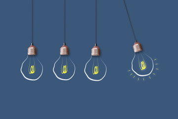 Concept Idea. Light bulb on a blue background. The concept of bright ideas for business, frequently...