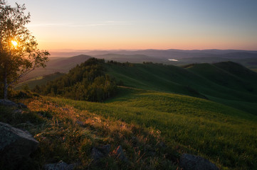 Country sunrise mountain hills with shades