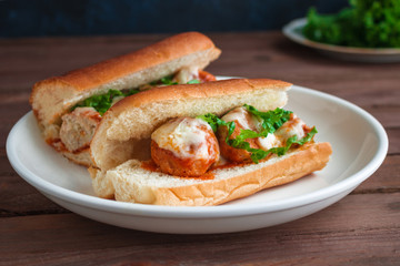 meatball sandwiches on white plate close up