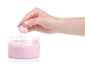 Bottle pink scrub for body in hand on white background isolation