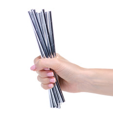 Cocktail tubes colorful in hand on white background isolation