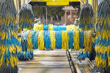     View of automatic car wash. Automatic car wash inside is empty without auto and does not work. View from inside the automatic car wash machine. 