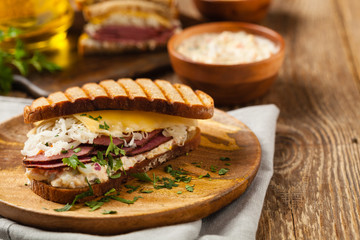 Ruben sandwich. New York sandwich with pastrami, sauce 1000 islands and sauerkraut.