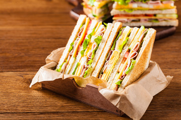 Delicious toast sandwich with ham, cheese, egg and vegetables.