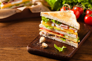 Delicious toast sandwich with ham, cheese, egg and vegetables.