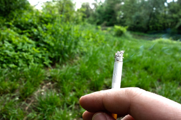 Smoking cigarettes in nature