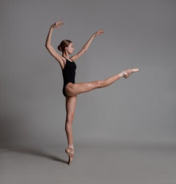 Fototapeta Beautiful flexible ballerina dancing in studio