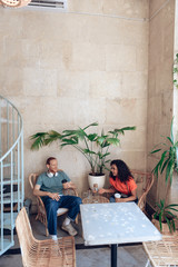 Young couple is having fun together in cafe