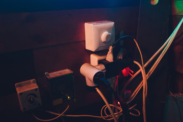 Multiple electrical plugs in wall outlet mixed up.