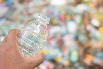 Hand Hold Show Recyclable Plastic for recycling concept reuse.