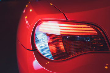 Close up projector Taillight of the modern and elegant car, automotive part concept.