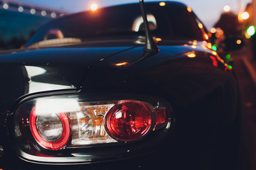 Close up projector Taillight of the modern and elegant car, automotive part concept.