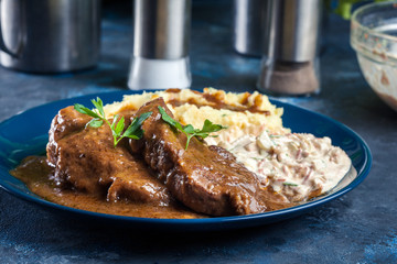 Stewed pork neck with potatoes and sauce