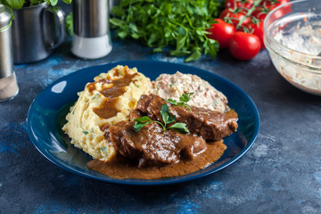 Stewed pork neck with potatoes and sauce