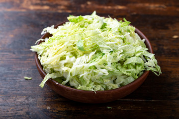 Savoy cabbage sliced in a clay plate