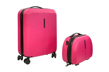 pair of pink luggage on wheels isolated on white background