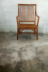 Wattled chair in colonial style, in cement room