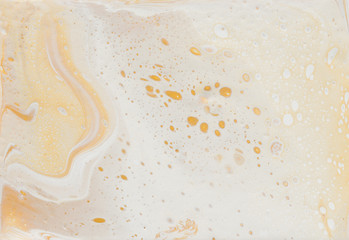 abstract marbleized effect background. gold and white creative colors. Beautiful paint with the addition of gold.