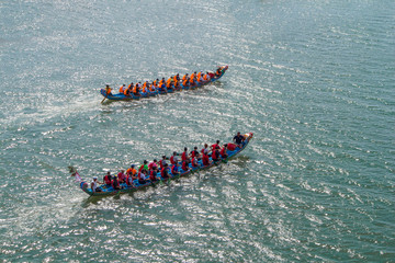 a dragon boat on the river and racing