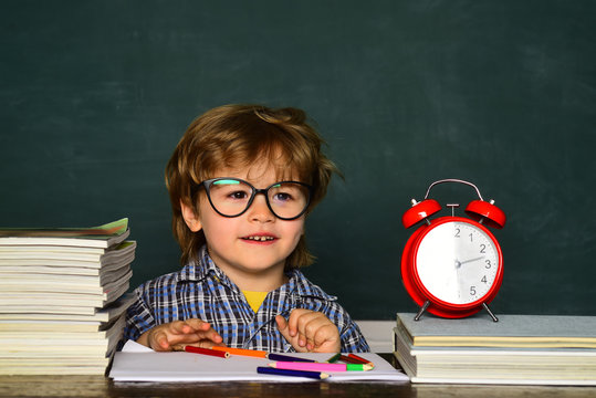 Great Study Achievement. Back To School. Education First. Cheerful Child Pupil At The Blackboard. Kids From Primary School. Talented Child. Hard Exam.