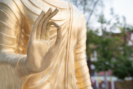 Brass hand of Buddha statue. - Image