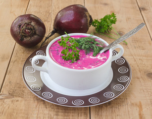 beet soup in bowl with bread