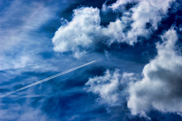 An airplane flying in the blue sky