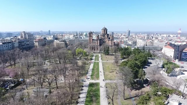 Aerial view of Tasmajdan park in the Belgrade city the capital of Serbia with Serbian Orthodox Church of Saint Marko  building and people walking view from above