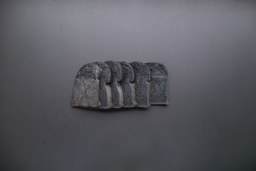 Organic bio charcoal bread on black background