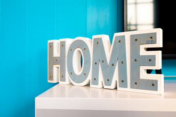 Text "HOME" on a blue background.