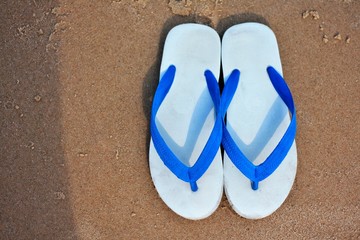 Flip flop OR slipper on Beach sand