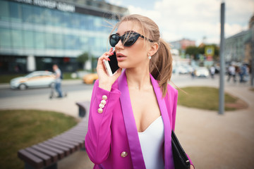 Young beautiful business woman talking on the phone. Business concept  