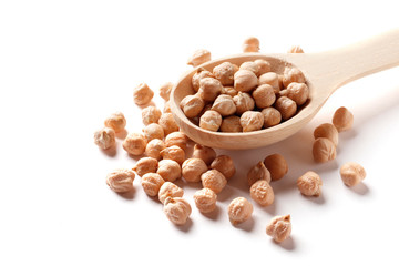 Chickpea in a wooden spoon isolated on white background