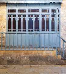 Changing rooms with blue wooden door shutters and wooden balustrades at historical traditional...