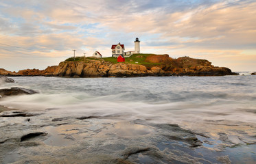 Cape Neddick Lighthouse At Sunset, Cape Neddick at Sohier Park, York, Maine. Cape Neddick Light Station was dedicated by the U.S. Lighthouse Service and put into use in 1879. It is still in use today.
