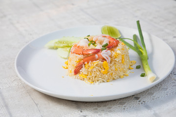 Fried rice with shrimp on the wooden table from top view